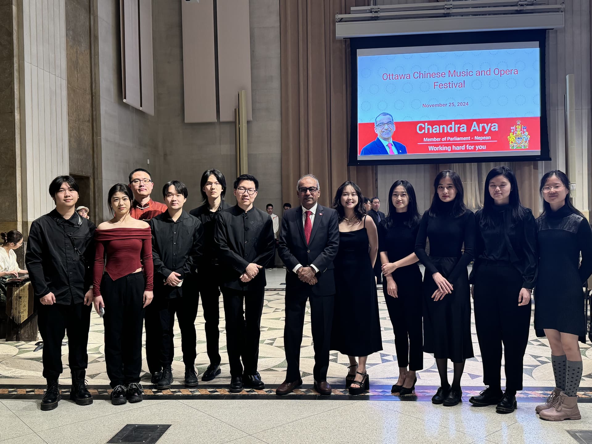 MCO members standing together after a performance at a reception